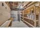 Unfinished basement featuring storage shelves at 2027 Kensington High Sw St, Lilburn, GA 30047