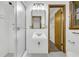 Bathroom featuring a stand up shower and sink with neutral color palette at 2027 Kensington High Sw St, Lilburn, GA 30047
