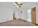 This cozy carpeted bedroom features a nearby bathroom and a spacious closet at 2027 Kensington High Sw St, Lilburn, GA 30047