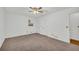 Bedroom featuring neutral carpet, ceiling fan, and closet storage at 2027 Kensington High Sw St, Lilburn, GA 30047