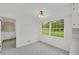 Bright eat-in kitchen area with large window and backyard views at 2027 Kensington High Sw St, Lilburn, GA 30047