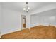Open dining room featuring hardwood floors and access to multiple rooms at 2027 Kensington High Sw St, Lilburn, GA 30047