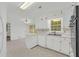 Classic white kitchen with patterned floors, bright cabinets and stainless steel appliances at 2027 Kensington High Sw St, Lilburn, GA 30047
