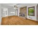 Open living area with fireplace, and views into the kitchen with wood-look floors at 2027 Kensington High Sw St, Lilburn, GA 30047