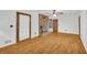 Open living room with brick fireplace, ceiling fan, and backyard access at 2027 Kensington High Sw St, Lilburn, GA 30047