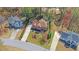 Aerial view of a brick home with well-kept lawn and landscaping at 2195 Brickton Sta, Buford, GA 30518