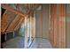 Unfinished attic featuring exposed beams, insulation, and flooring at 2195 Brickton Sta, Buford, GA 30518