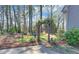 A private backyard setting, complete with a stone fountain, leads to a fire pit area with lattice fencing at 2195 Brickton Sta, Buford, GA 30518