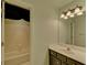 Bathroom showcasing a vanity with sink and mirror, as well as a tub and shower at 2195 Brickton Sta, Buford, GA 30518