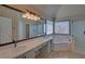 Spacious bathroom featuring a vanity, corner tub, and glass-enclosed shower at 2195 Brickton Sta, Buford, GA 30518