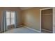 Cozy bedroom featuring carpet, a window with blinds, and an ample closet space at 2195 Brickton Sta, Buford, GA 30518