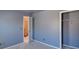 Bedroom featuring 2 windows, neutral walls, and closet space at 2195 Brickton Sta, Buford, GA 30518