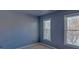 Comfortable bedroom featuring two windows that provide natural light and a neutral color palette at 2195 Brickton Sta, Buford, GA 30518