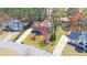 An eye-level view highlights a well-manicured lawn and landscaped front yard of a stately two-story brick home at 2195 Brickton Sta, Buford, GA 30518
