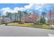 A manicured lawn and landscaped front yard enhance the curb appeal of this stately two-story brick home at 2195 Brickton Sta, Buford, GA 30518
