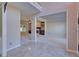 Bright foyer with tile flooring that leads to multiple living areas; high ceilings give an airy feel at 2195 Brickton Sta, Buford, GA 30518