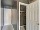 Hallway featuring neutral-toned walls, and white doors, leading to ample closet space at 2195 Brickton Sta, Buford, GA 30518