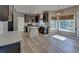 Open concept kitchen with a view into the breakfast nook and stainless appliances at 2195 Brickton Sta, Buford, GA 30518