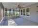 This is a view of the screened in porch showing the neutral decor and sun shades at 2195 Brickton Sta, Buford, GA 30518