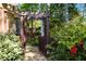 Landscaped stone path leading to backyard with seating area and mature trees at 2801 Livsey Dr, Tucker, GA 30084