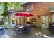 Brick home with large deck with table seating overlooking the beautiful yard in a peaceful backyard retreat at 2801 Livsey Dr, Tucker, GA 30084