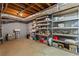 Unfinished basement area with open shelving, providing ample storage space for a variety of items at 2801 Livsey Dr, Tucker, GA 30084