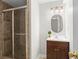 Bathroom featuring a glass enclosed shower, vanity with sink, and modern light fixtures for a clean look at 2801 Livsey Dr, Tucker, GA 30084