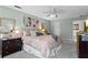 Airy bedroom with a comfortable bed, soft carpet, and refreshing light-green wall color at 2801 Livsey Dr, Tucker, GA 30084