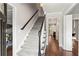 Bright foyer with a carpeted staircase, hardwood floors, and white trim at 2801 Livsey Dr, Tucker, GA 30084