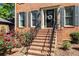 Welcoming front entrance with a brick staircase, iron railings, and a decorative wreath at 2801 Livsey Dr, Tucker, GA 30084