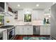 Bright kitchen featuring stainless steel appliances, white cabinets, a window, and plenty of countertop space at 2801 Livsey Dr, Tucker, GA 30084