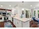 Bright open kitchen features granite countertops, stainless steel appliances, and a view to the breakfast area at 2801 Livsey Dr, Tucker, GA 30084