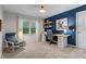 Office space featuring built-in shelving, comfortable seating, and great natural light at 2801 Livsey Dr, Tucker, GA 30084