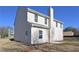 Rear exterior showcasing a well-maintained yard, siding, windows, and chimney at 484 Charleston Pl, Villa Rica, GA 30180