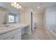 This bathroom features tile floors and countertops, with a large mirror at 484 Charleston Pl, Villa Rica, GA 30180