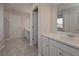 This bathroom features tile floors and countertops, and dual sinks at 484 Charleston Pl, Villa Rica, GA 30180