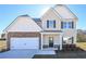 Two-story home featuring a two-car garage, stone accents, and a covered front entry at 484 Charleston Pl, Villa Rica, GA 30180