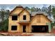 Exterior view of new construction home with wood sheathing and open garage at 484 Charleston Pl, Villa Rica, GA 30180