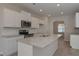 Spacious kitchen with granite countertops, stainless steel appliances and white cabinets at 484 Charleston Pl, Villa Rica, GA 30180