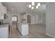 Open kitchen with a center island, stainless steel appliances and wood flooring at 484 Charleston Pl, Villa Rica, GA 30180