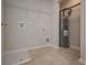 This laundry room features tile floors, shelving and a water heater at 484 Charleston Pl, Villa Rica, GA 30180