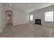 Bright living room boasts hardwood floors and a cozy fireplace at 484 Charleston Pl, Villa Rica, GA 30180