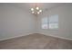 Cozy living room with plenty of natural light, wood floors and modern light fixture at 484 Charleston Pl, Villa Rica, GA 30180