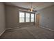 Spacious bedroom featuring neutral carpet, stylish lighting and bright windows at 6603 Sterling Dr, Atlanta, GA 30328