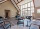 Vaulted clubhouse with wood flooring, floor to ceiling windows, and modern seating at 6603 Sterling Dr, Atlanta, GA 30328