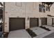 Townhome exteriors featuring individual garages and brick facade at 6603 Sterling Dr, Atlanta, GA 30328