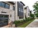 Charming townhome with brick exterior, black trim and landscaped front yard at 6603 Sterling Dr, Atlanta, GA 30328