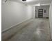 A large garage with a storage shelf offers ample space for vehicles, tools, and organization at 6603 Sterling Dr, Atlanta, GA 30328