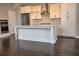 Modern kitchen with white cabinets, stainless steel appliances and a center island at 6603 Sterling Dr, Atlanta, GA 30328