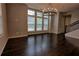 Inviting living room featuring hardwood floors, lots of windows and modern chandelier at 6603 Sterling Dr, Atlanta, GA 30328